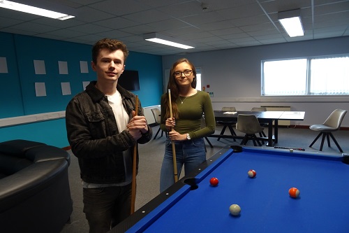 Image of Will and Charlotte playing a game of pool